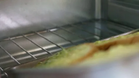 Garlic Bread in the Hot Oven Stock Footage 79597756