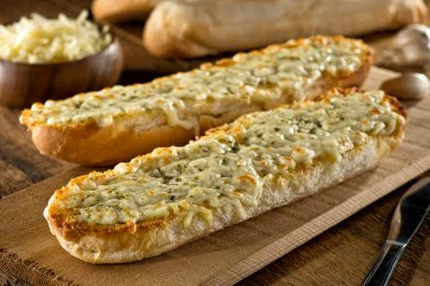 Garlic Bread with Melted Mozzarella Cheese and Herbs Stock Photos