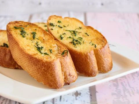 GARLIC BREAD Toast served in dish isolated wooden table top view arabic foo.. Foto stock