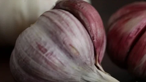 Garlic Bulb Crashes into another Garlic Bulb Closeup 動画素材 99163617