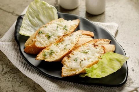 Garlic Cheese Bread served in a dish isolated on grey background side view fa Stock Photos