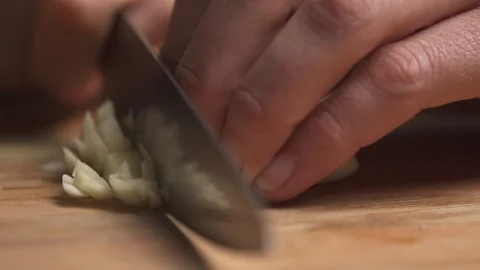 Garlic chopped by chef Stock Footage 127122038