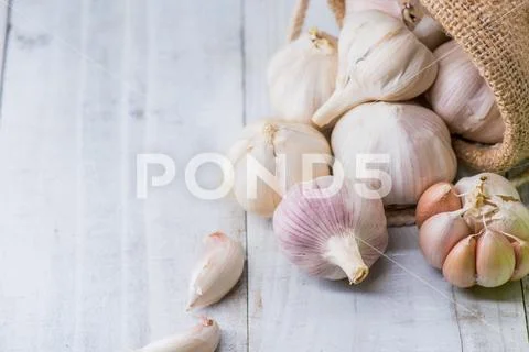 Garlic Cloves and Bulb for food cooking in the kitchen Stock Photos