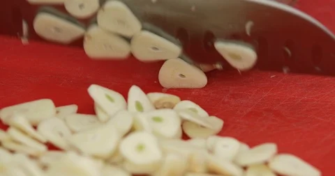 Garlic cloves chopping, close-up Stock Footage 126944442
