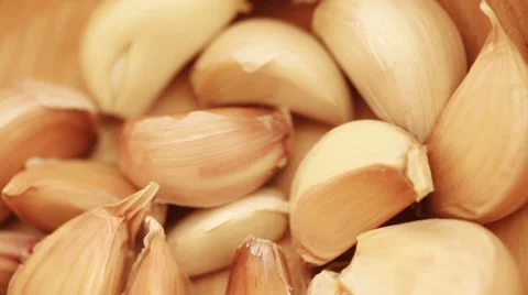 Garlic cloves close up rotating Video stock 35931537