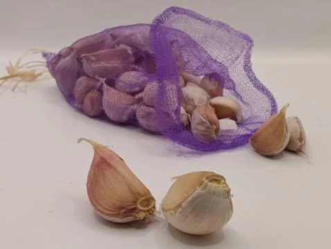 Garlic cloves on a light background Stock Photos