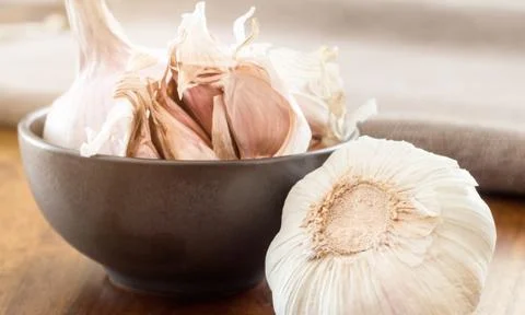 Garlic cloves on table Stock Photos