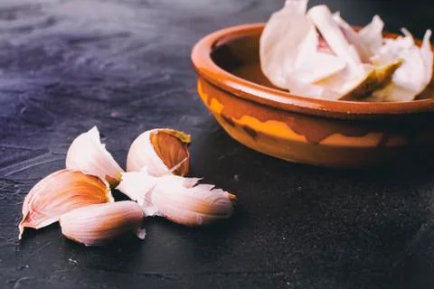 Garlic cloves in a vintage setting. Stock Photos
