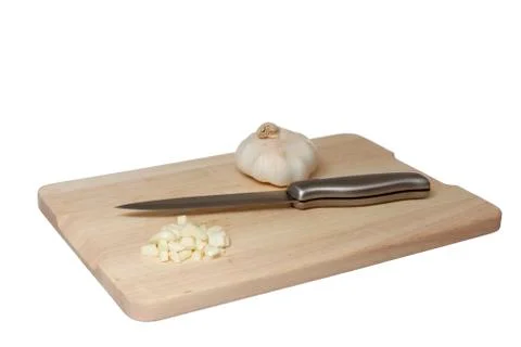 Garlic on cutting board Stock Photos