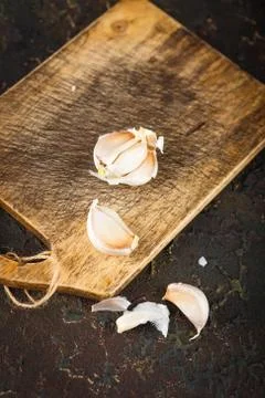 Garlic on Cutting Board Stock Photos