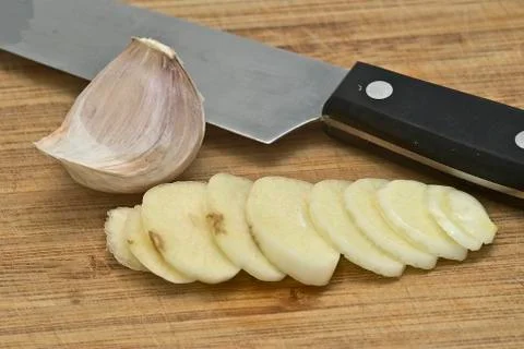 Garlic on the cutting table. Stock Photos