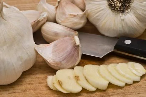 Garlic on the cutting table. Stock Photos