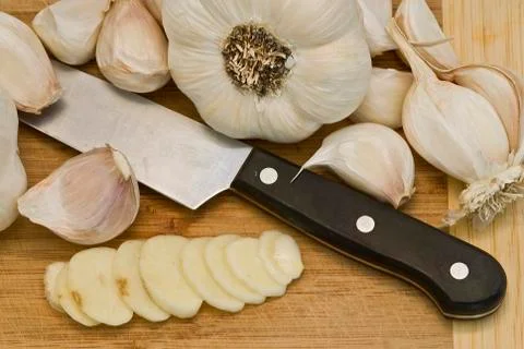 Garlic on the cutting table. Stock Photos