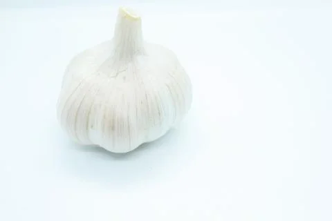 Garlic head located on a white background Stock Photos