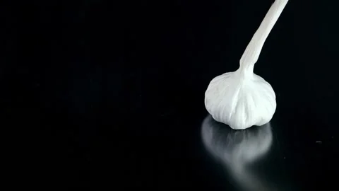 Garlic isolated on black background Stock Footage 132917235