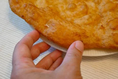 Garlic langos on a plate Stock Photos