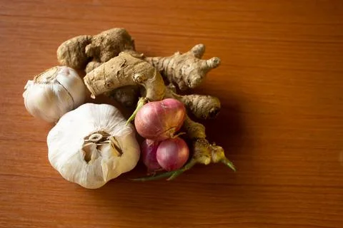 Garlic, onion and ginger placed on the table are brown Stock Photos