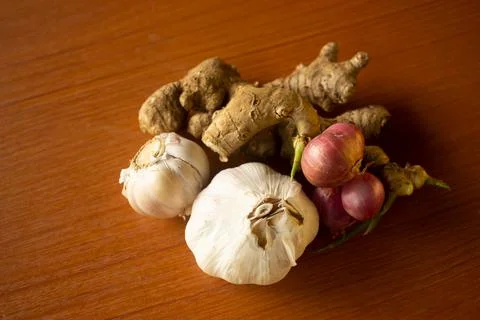 Garlic, onion and ginger placed on the table are brown Stock Photos