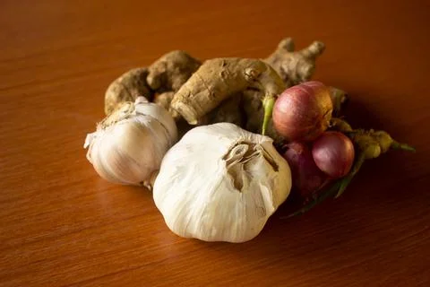 Garlic, onion and ginger placed on the table are brown Stock Photos
