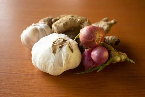 Garlic, onion and ginger placed on the table are brown Stock Photos