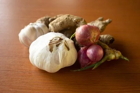 Garlic, onion and ginger placed on the table are brown Stock Photos