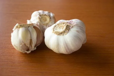 The garlic placed on the table is brown Stock Photos