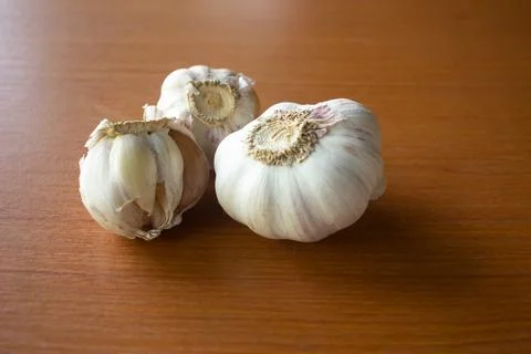 The garlic placed on the table is brown Stock Photos