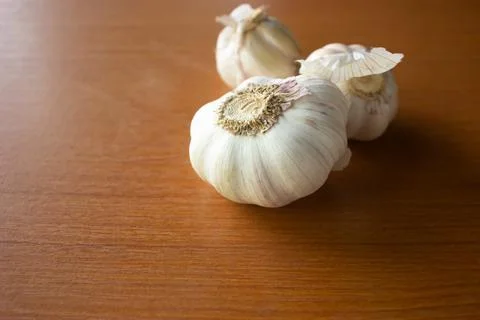 The garlic placed on the table is brown Stock Photos