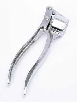 Garlic press full view with cup Stock Photos