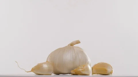 Garlic on a rotating plate Stock Footage 99724963