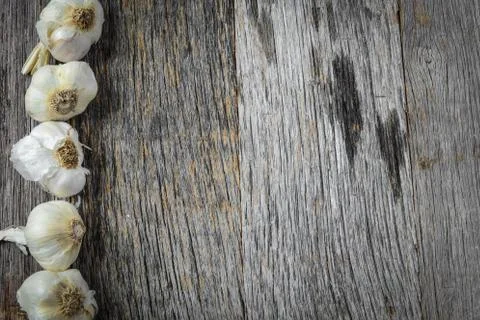 Garlic on rustic wood background Stock Photos