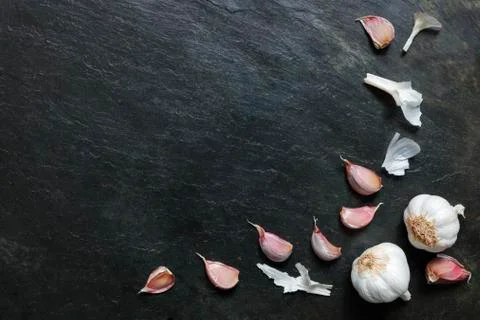 Garlic on slate with copy space Stock Photos