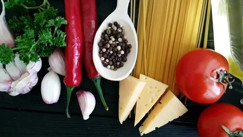 Garlic spaghetti on a black wooden background Stock Footage 88651153
