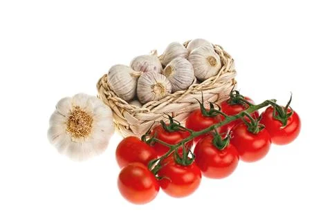 Garlic, tomatoes Stock Photos