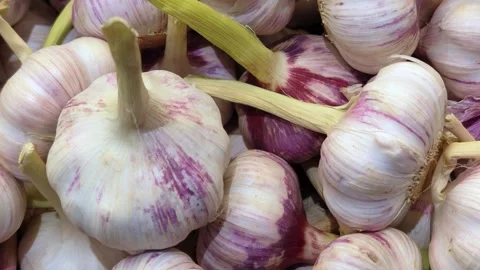 Garlic top view. Garlic texture. Organic vegetable texture. Grocery store. Stock Footage 310721225