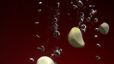 Garlic in water, Slow Motion Stock Footage 31819567