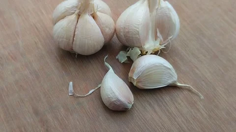Garlic on wood texture background Stock Footage 308770682