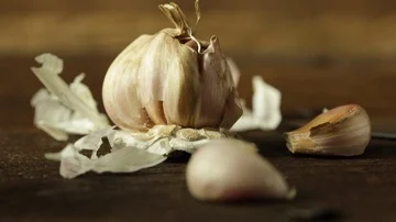 Garlic on a Wooden Table Stock Footage 86135148