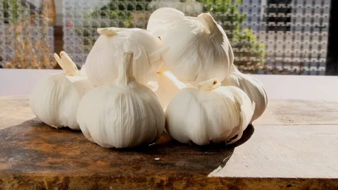 Garlic On Wooden Table Stock Footage 100256078