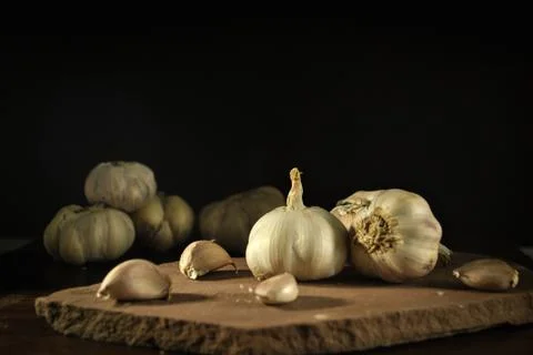 The garlics on black background Stock Photos