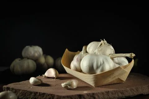 The garlics on black background Stock Photos