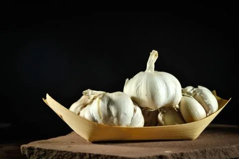 The garlics on black background Stock Photos