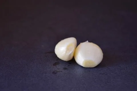 Garlics on a black background Stock Photos