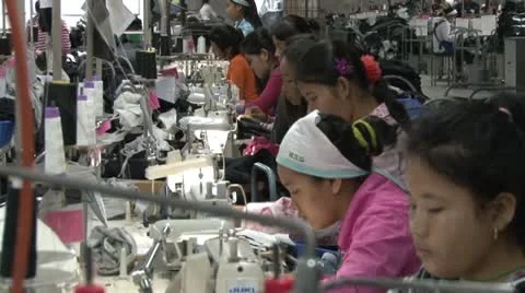 Garment Factory Workers: Striking Telephoto view of line of workers in Asia Stock Footage