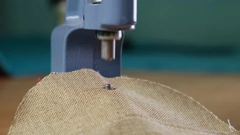 Garment Making Workshop. Factory. Piece of Cloth is Fastened under Small Press Stock Footage 145044052