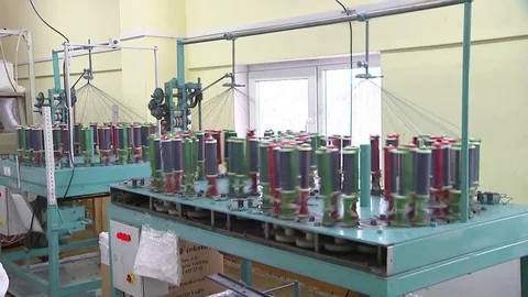 Garment manufacturing, with the coils coming off the thread, the General plan Stock Footage 82659065