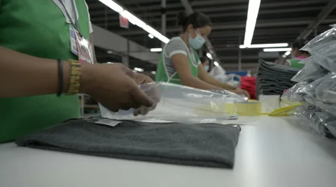 Garment workers preparing and folding clothes Stock Footage 43201001
