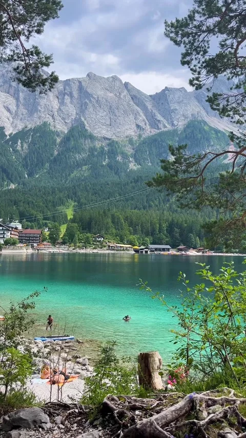 Garmisch-Partenkirchen, Germany, August 6, 2025: A picturesque lake with mountai Stock Footage 314493219