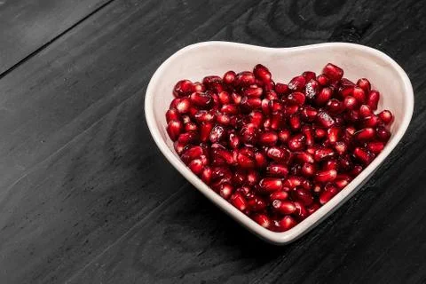 Garnet on black in dish Stock Photos