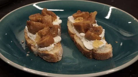 Garnishing bruschetta with mint Stock Footage 113527556